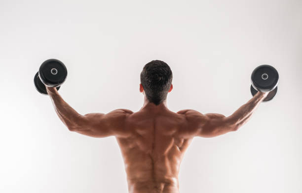 A person performing bent-over rows with a dumbbell in each hand.