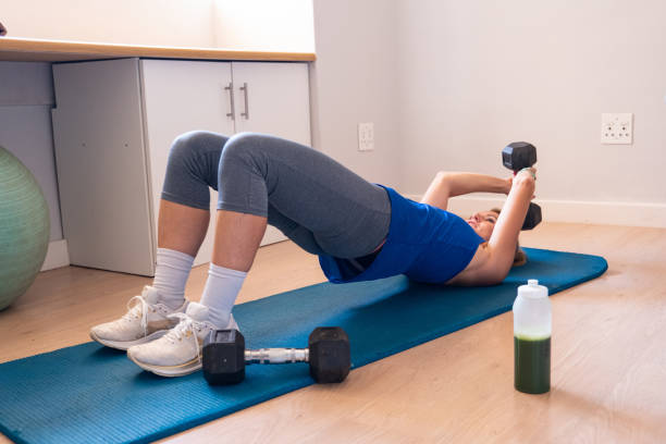 An athlete performing a Bulgarian split squat with dumbbells on a bench.